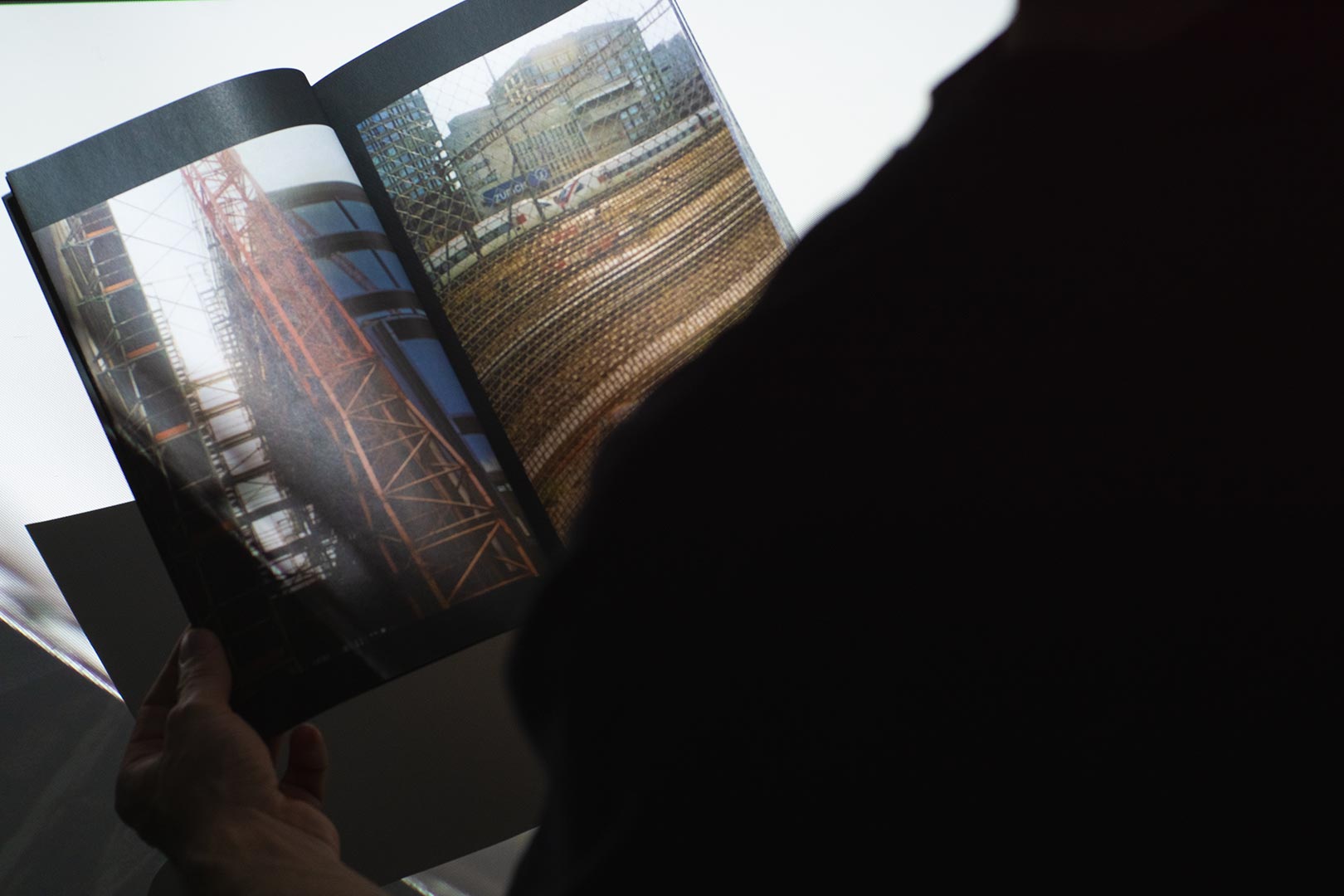 Gallery Refugium book at the exhibition held open by someone